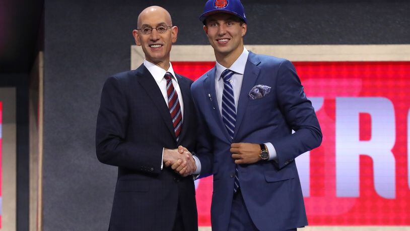NEW YORK, NY - JUNE 22:  Luke Kennard walks on stage with NBA commissioner Adam Silver after being drafted 12th overall by the Detroit Pistons during the first round of the 2017 NBA Draft at Barclays Center on June 22, 2017 in New York City. NOTE TO USER: User expressly acknowledges and agrees that, by downloading and or using this photograph, User is consenting to the terms and conditions of the Getty Images License Agreement.  (Photo by Mike Stobe/Getty Images)