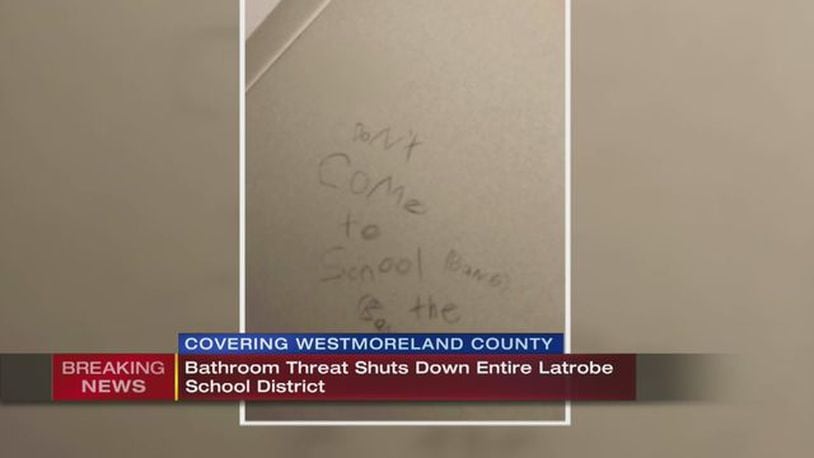 A threat written on a bathroom in a Latrobe, Pennsylvania school has led to the cancellation of classes on Friday.