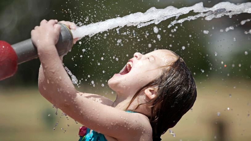 OKLAHOMA CITY, OKLAHOMA - JULY 20: Hanna Hammond, 4, plays at the public sprayground at Memorial Park July 21, 2011 in Oklahoma City, Oklahoma. Temperatures in Oklahoma City have exceeded 100 degrees Fahrenheit for 30 days straight as of yesterday. (Photo by Brett Deering/Getty Images)