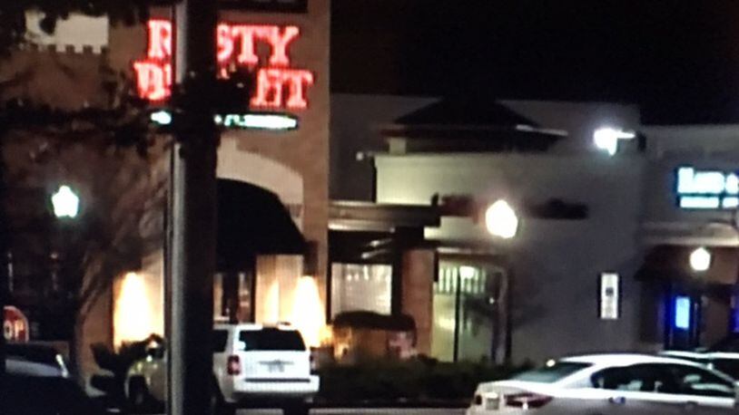 A suspicious package found attached to a car near the Rusty Bucket at the Dayton Mall in Miami Twp. Monday night caused an investigation by the Dayton Bomb Squad. STAFF