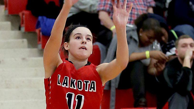 Lakota West’s Madisyn Oxley connects for a 3-pointer against Fairmont on Nov. 27, 2016, at West. CONTRIBUTED PHOTO BY E.L. HUBBARD