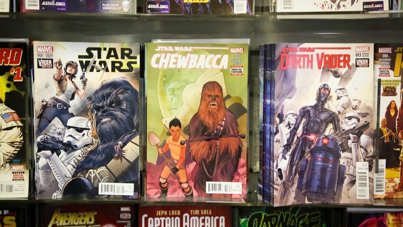 The popular Star Wars comics on display at Queen City Comics Fairfield, Thursday, Dec. 10, 2015. GREG LYNCH / STAFF