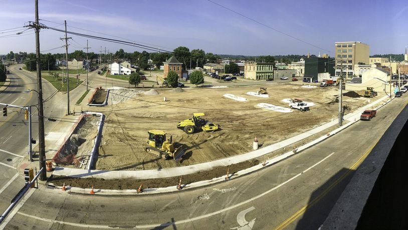 Hamilton is building a new parking lot behind Butler County’s parking garage adjacent to the county/city government complex, for the convenience of existing and future employers. GREG LYNCH / JOURNAL-NEWS
