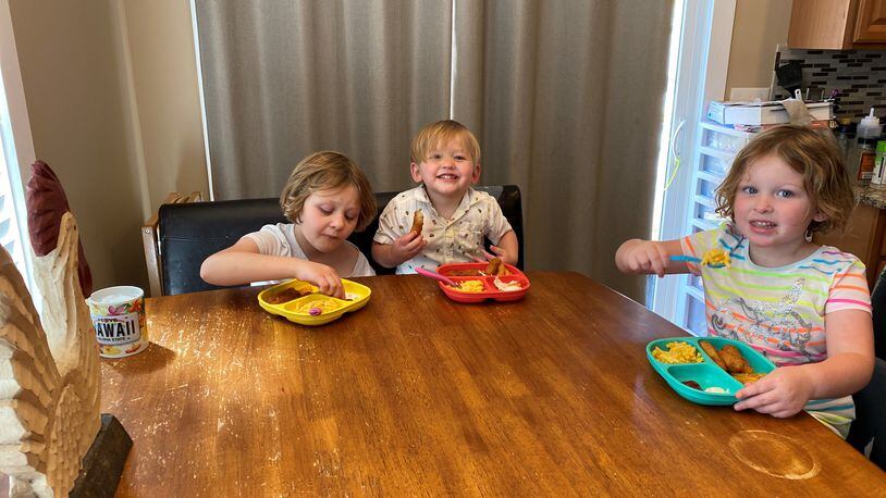 Alexis (from left), Bentley and Chloe Becker eat lunch during their break from school. Their mom, Tiffany plans their meals a week in advance to save prep time. CONTRIBUTED