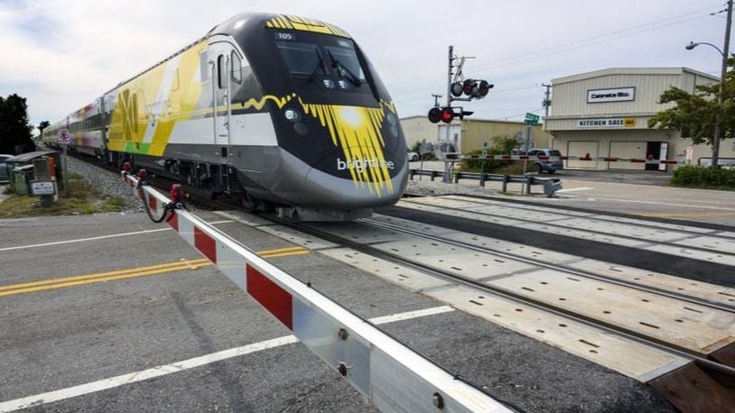 A Brightline train northbound from Ft. Lauderdale, Florida, to West Palm Beach crosses Northeast Sixth Avenue in Boynton Beach Wednesday, January 17, 2018, where Melissa Lavell, 32, was fatally struck by one of the passenger trains Friday night. Witnesses told police that Lavell appeared to be crossing the tracks after the guard gates were in the down position in an attempt to make it across before the train passed.