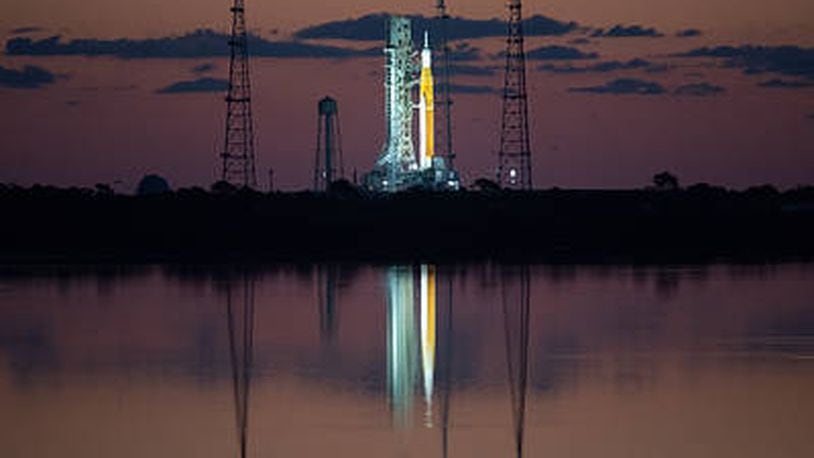 NASA’s Space Launch System (SLS) rocket with the Orion spacecraft aboard is seen at sunrise atop a mobile launcher at Launch Complex 39B, Monday, April 4, 2022, as the Artemis I launch team conducts the wet dress rehearsal test at NASA’s Kennedy Space Center in Florida. Ahead of NASA’s Artemis I flight test, the wet dress rehearsal will run the Artemis I launch team through operations to load propellant, conduct a full launch countdown, demonstrate the ability to recycle the countdown clock, and drain the tanks to practice timelines and procedures for launch.  Photo Credit: (NASA/Joel Kowsky)