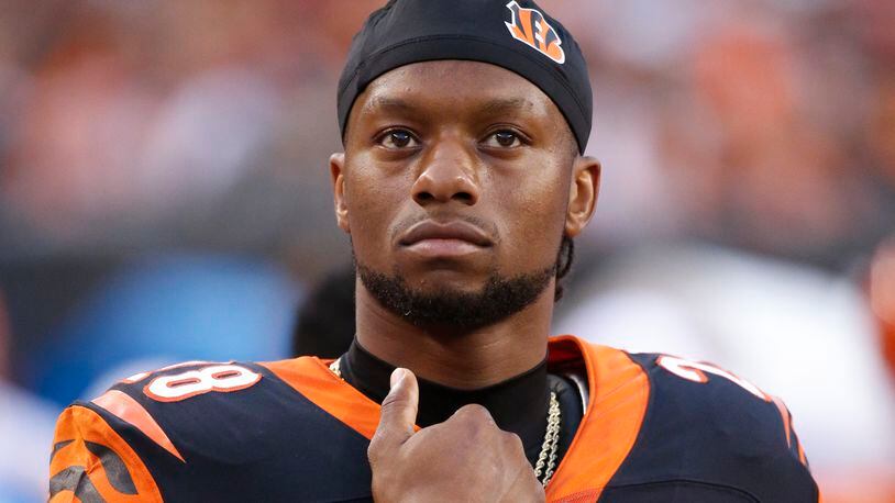 Cincinnati Bengals running back Joe Mixon stands on the sidelines during the first half of an NFL preseason football game against the New York Giants, Thursday, Aug. 22, 2019, in Cincinnati. (AP Photo/Frank Victores)