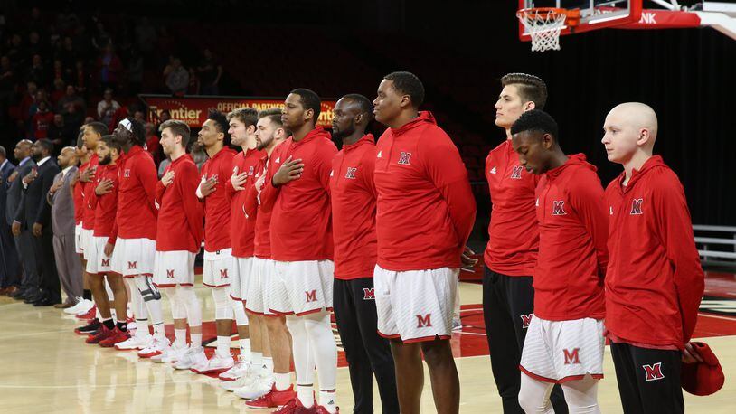 Jackson Hogenkamp stands with Miami’s men’s basketball team for the National Anthem before Saturday’s game against Ball State. CONTRIBUTED