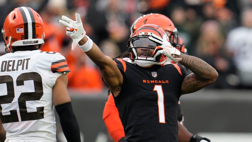 Cincinnati Bengals' Ja'Marr Chase (1) reacts after a first down catch during the second half of an NFL football game against the Cleveland Browns, Sunday, Dec. 11, 2022, in Cincinnati. (AP Photo/Jeff Dean)