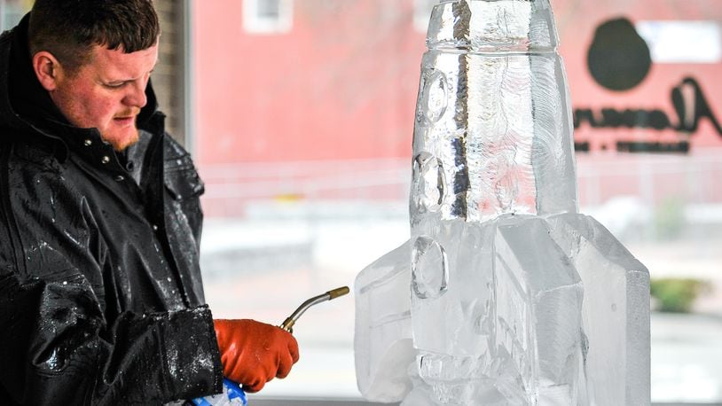 Jon Michael, lead carver with Artic Diamond Ice Sculptures, created a sculpture of a rocket during a media preview event for IceFest 2017 Friday, Jan. 13 at Startek in Hamilton. That year’s particular IceFest, held every other year by the nonprofit City of Sculpture, took place on Jan. 20 & 21, 2017 in downtown Hamilton. NICK GRAHAM/STAFF