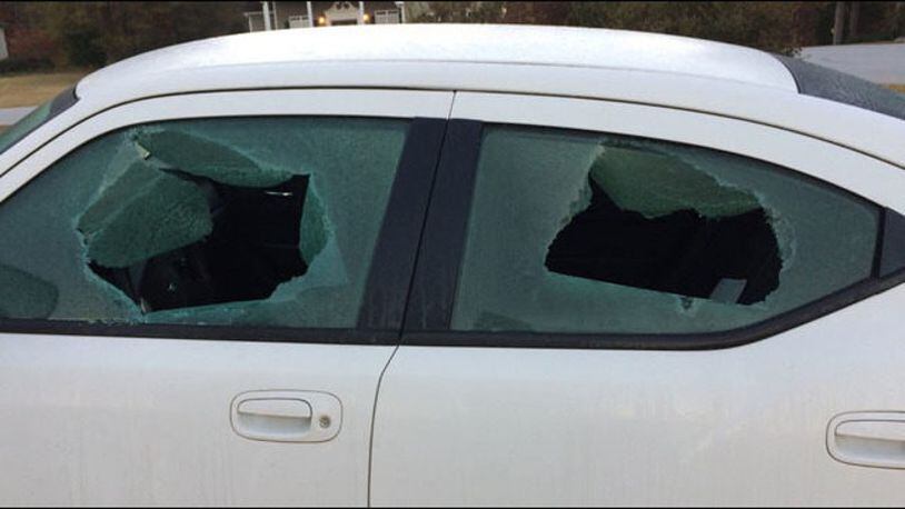 Bullet holes cover the home and car of the assistant police chief in Monroe. (Credit: WSBTV.com)