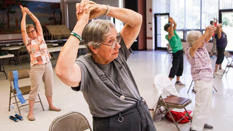 Older adults exercise at the Fairborn Senior Center. The majority of Ohioans 50 and older say concerns about health care will affect their vote this fall. CHRIS STEWART / STAFF