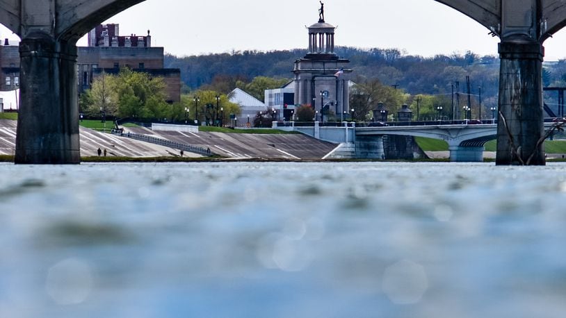 The High-Main Bridge and Soldiers, Sailors and Pioneers Monument is visible under the arches of the Black Street Bridge Wednesday, April 22, 2020 in Hamilton. View looking along the Great Miami River From Combs Park. NICK GRAHAM / STAFF