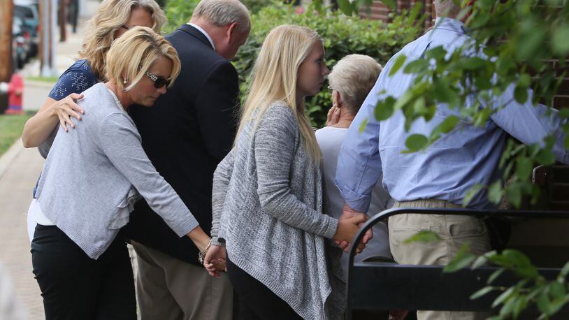 Brooke Skylar Richardson, center, is escorted into court on July 21, 2017, in a preliminary hearing on a charge of reckless homicide in the death of her infant baby, found buried in the backyard of her Carlisle family home. STAFF/GREG LYNCH