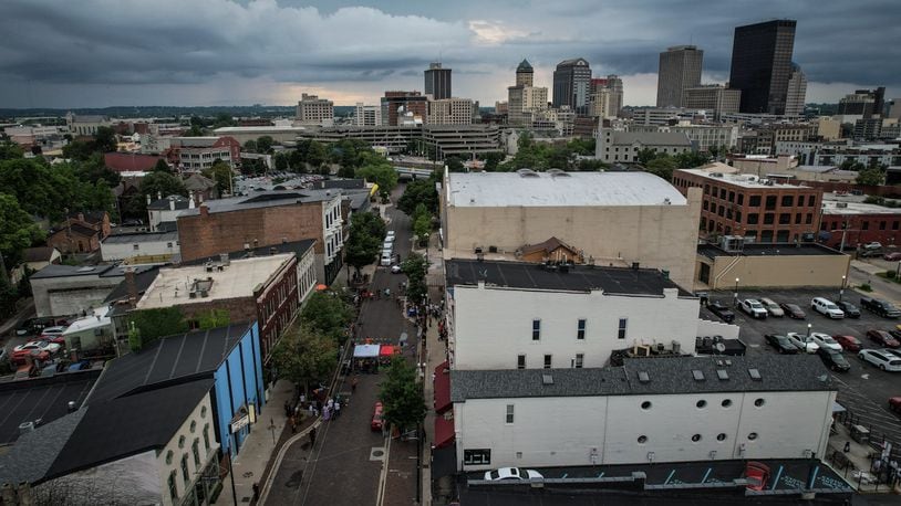 This is a drone photograph looking northwest at Fifth Street, lower left, to downtown Dayton. The third anniversary of the Oregon District mass shooting was held Thursday, Aug. 4, 2022.  JIM NOELKER/STAFF