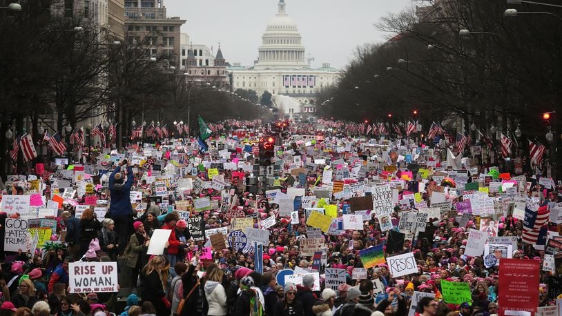 WASHINGTON, DC - Protesters walk up Pennsylvania Avenue during the Women's March on Washington, with the U.S. Capitol in the background, on January 21, 2017 in Washington, DC. Women will march in cities across the United States on Wednesday,  March 8, 2017, during the "A Day Without a Woman" march. (Photo by Mario Tama/Getty Images)