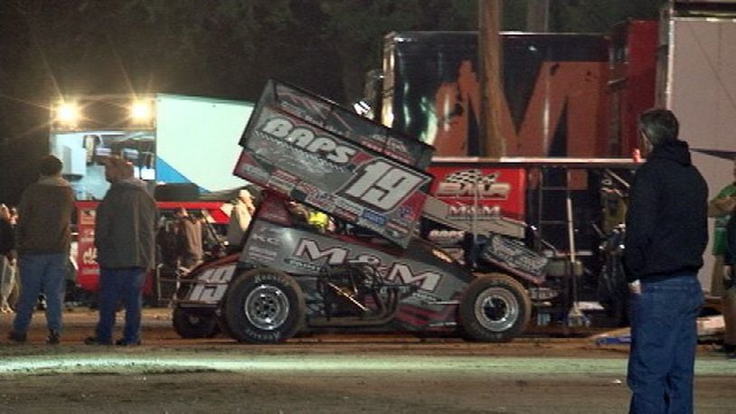 Three spectators were injured Sunday evening when a sprint car flipped off the dirt track and into the crowd at Volusia Speedway Park, the Volusia County Sheriff’s Office said. (Photo: WFTV/Twitter)