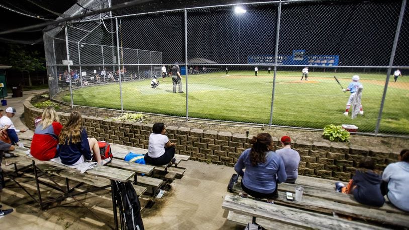 The lights were on as baseball action started up again just after midnight Tuesday morning, May 26, 2020, at West Side Little League fields in Hamilton. The stands are antiquated and are a safety concern, according to West Side Little League. The organization, which started in 1953, is embarking on a $1 million capital campaign to make facility upgrades, including new spectator stands that are safer, said WSLL Board President Josh Davidson. NICK GRAHAM/FILE
