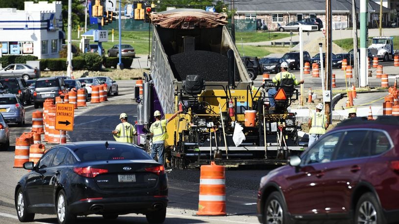 FILE PHOTO: Crews pave a section of South Gilmore Road at Ohio 4 in Fairfield in 2018.