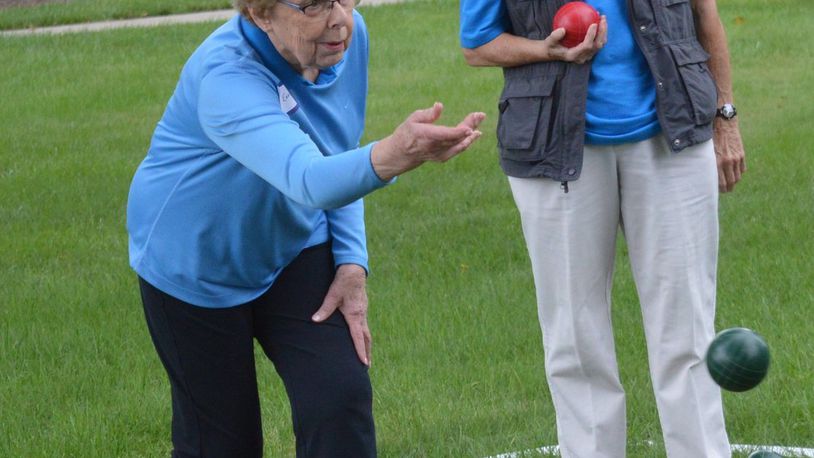Evelyn Coltharp teamed up to win the bocce ball tournament for the Masters Games played on the grass at the TRI building. CONTRIBUTED/BOB RATTERMAN