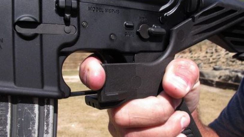 An AR-15 rifle fitted with a bump stock. FILE PHOTO