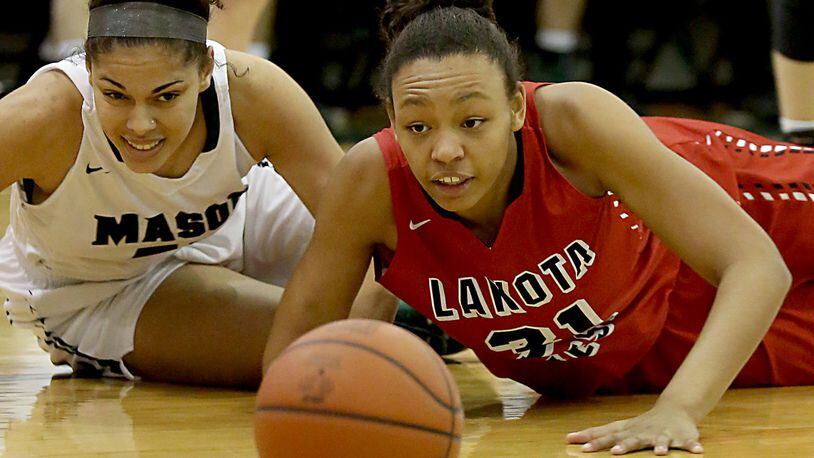 Mason’s Tihanna Fulton (left) and Lakota West’s Nevaeh Dean keep their eyes on the ball during Saturday afternoon’s game at the Mason Arena. CONTRIBUTED PHOTO BY E.L. HUBBARD