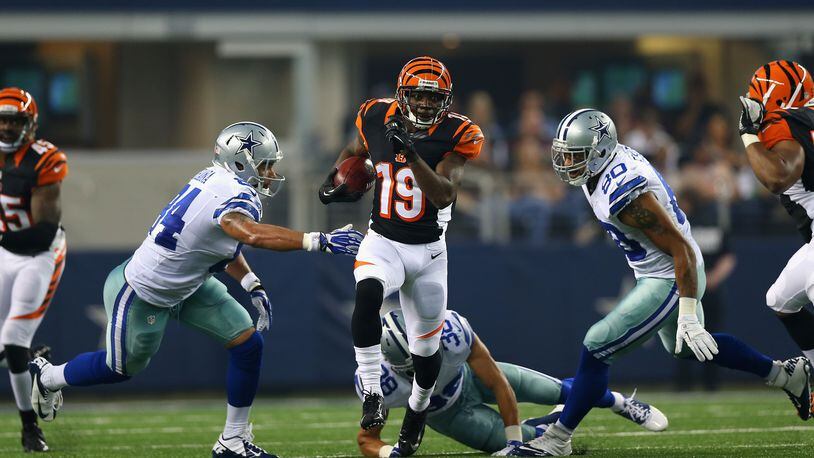 ARLINGTON, TX - AUGUST 24: Brandon Tate #19 of the Cincinnati Bengals returns a punt for a touchdown against the Dallas Cowboys during a preseason game at AT&T Stadium on August 24, 2013 in Arlington, Texas. (Photo by Ronald Martinez/Getty Images)