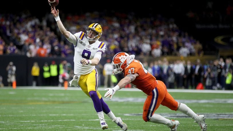 NEW ORLEANS, LOUISIANA - JANUARY 13: Joe Burrow #9 of the LSU Tigers throws the ball under pressure as James Skalski #47 of the Clemson Tigers tries to defend during the College Football Playoff National Championship game at Mercedes Benz Superdome on January 13, 2020 in New Orleans, Louisiana. (Photo by Chris Graythen/Getty Images)