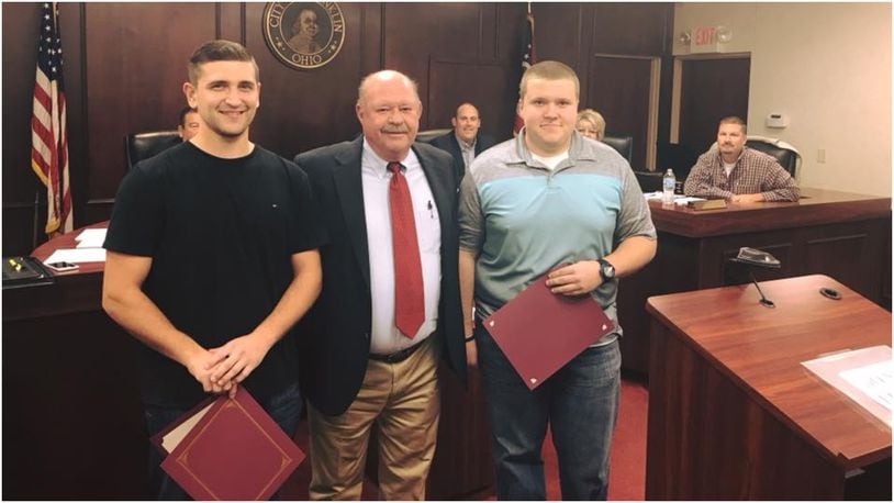 Franklin City Council presented the city’s Good Neighbor Award to two Zink’s Meat Market employees on Monday. Adam Myers (left) and Corey Davis (right) performed the Heimlich maneuver on a customer who was choking inside the store. They are pictured with Franklin Mayor Denny Centers. CONTRIBUTED/CITY OF FRANKLIN