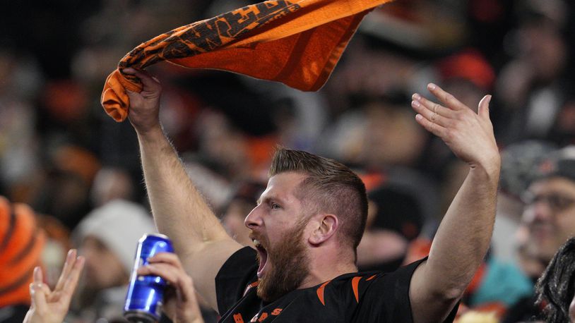 A fan cheers in the first half of an NFL wild-card playoff football game between the Baltimore Ravens and Cincinnati Bengals in Cincinnati, Sunday, Jan. 15, 2023. (AP Photo/Jeff Dean)