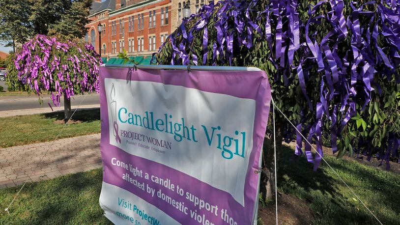 Project Woman holds a candlelight vigil annually in October to show their support for the victims of domestic violence and raise awareness of the issue. BILL LACKEY/STAFF Bill Lackey/Staff