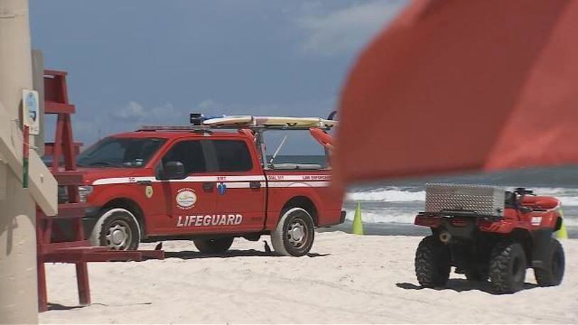 A woman was run over by a motorized trash cart Saturday while she was lying in the sand. (Photo: WFTV.com)