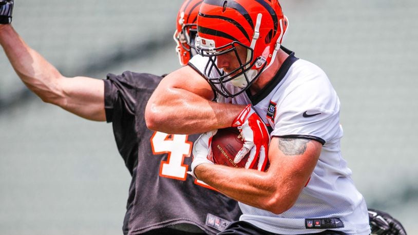Cincinnati Bengals tight end Matt Lengel makes a catch defended by safety Clayton Fejedelem on the first day of mandatory mini camp Tuesday, June 14 at Paul Brown Stadium in Cincinnati. NICK GRAHAM/STAFF