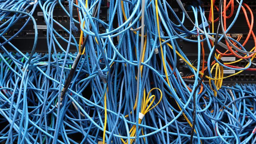 Network cables are plugged in a server room on November 10, 2014 in New York City. (Photo by Michael Bocchieri/Getty Images)