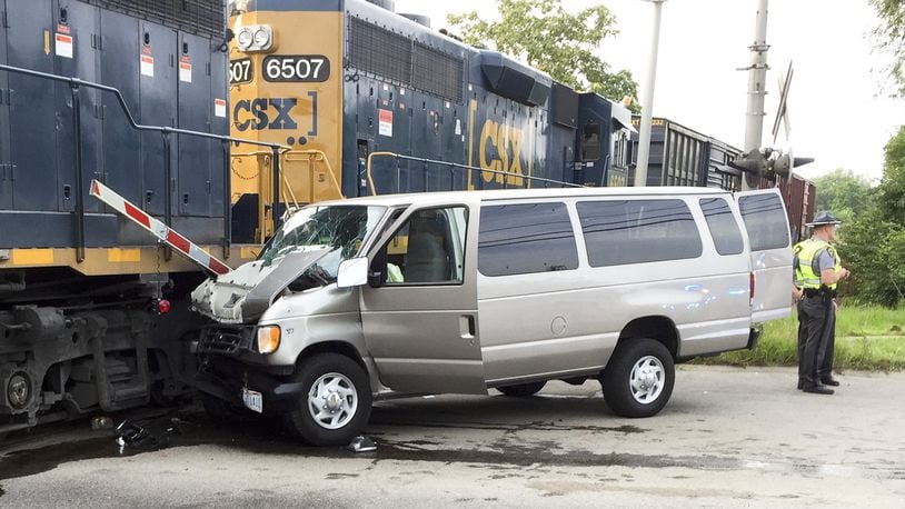 One woman was killed and several children were injured July 28 when the van they were driving to vacation Bible school at their Middletown church hit a train at the intersection of University Boulevard and 14th Avenue. ED RICHTER/STAFF