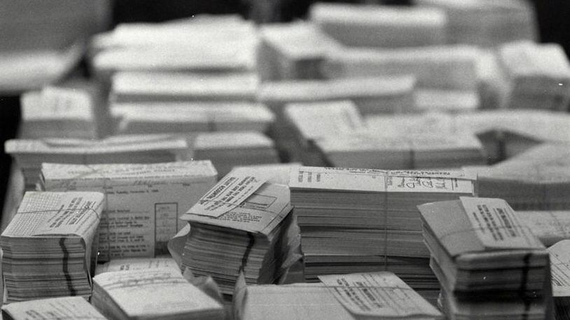 Paper voting ballots are stacked to be counted at Butler County Board of Elections on Nov. 8, 1988.