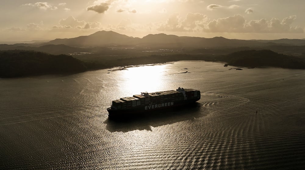 A cargo ship transits the Panama Canal in Panama City, Thursday, March 12, 2026. (AP Photo/Matias Delacroix)