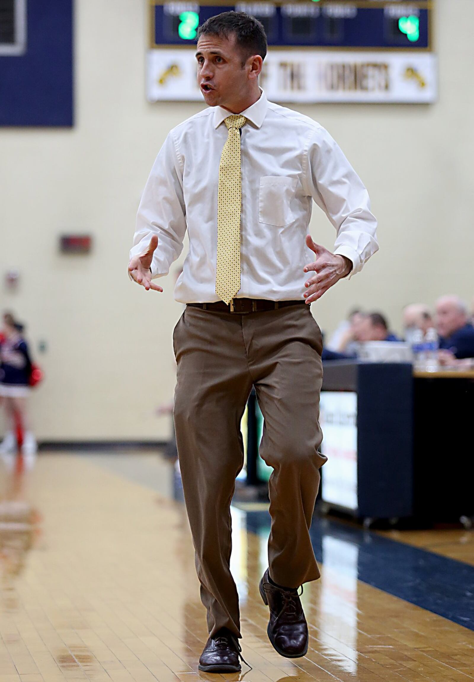 Monroe coach Kenny Molz instructs his team during Tuesday night’s game against Talawanda at Monroe. CONTRIBUTED PHOTO BY E.L. HUBBARD