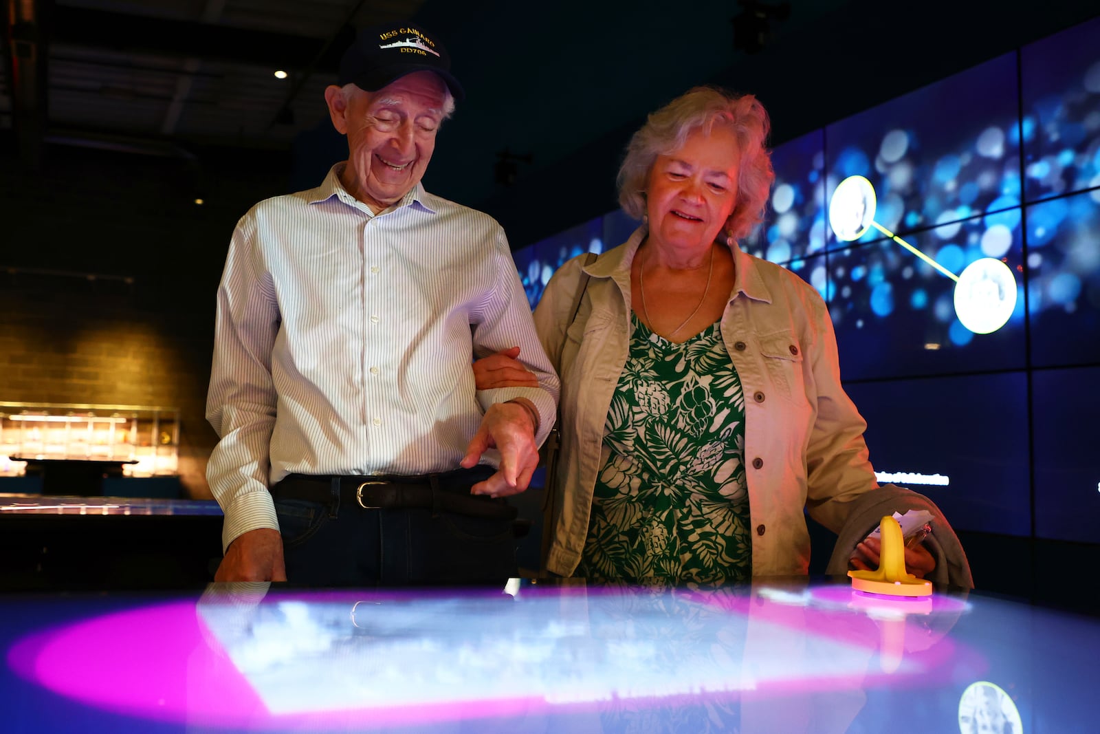 Mario and Gail Cirasunda, of Orchard Park, N.Y., interact with one of the museum's touch screen exhibits during a Memory Cafe event at the National Comedy Center Monday, May 5, 2025, in Jamestown, N.Y. (AP Photo/Jeffrey T. Barnes)