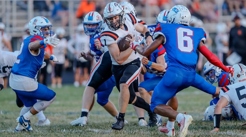 Waynesville High School senior Alex Amburgy runs the ball during their game against Greeneview this season in Jamestown. The Rams won 40-28. Michael Cooper/CONTRIBUTED