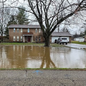 Heavy rains hit the Miami with significant flooding this week. Here is a yard flooded is Taylor School Road in Butler County. Staff Photos by Nick Graham.