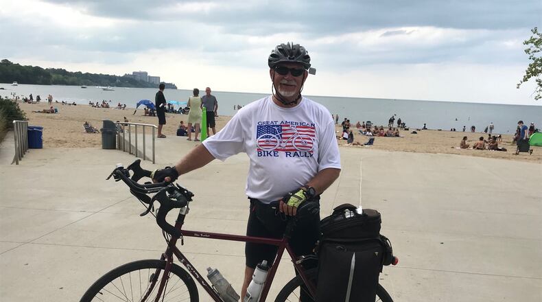 With the novel coronavirus, COVID-19, there cannot be a Great American Bike Rally this year, so co-organizer Dean Bruewer embarked on a 300-plus-mile fundraiser to help fill the void. Pictured is Bruewer at Lake Erie at the end of his 344-mile journey from Fairfield to Cleveland. PROVIDED