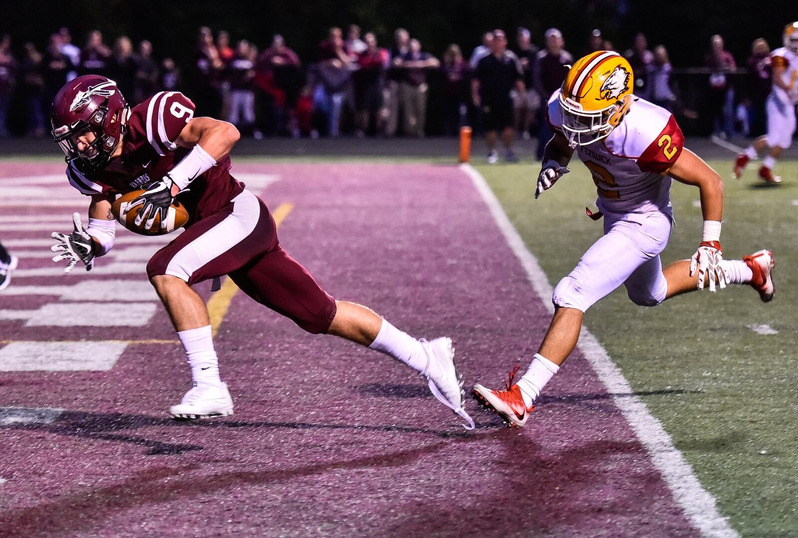Lebanon’s Derrick Allen scores a touchdown as he is trailed by Fenwick’s R.J. Clesceri during their game Sept. 8 at Jim VanDeGrift Stadium in Lebanon. NICK GRAHAM/STAFF