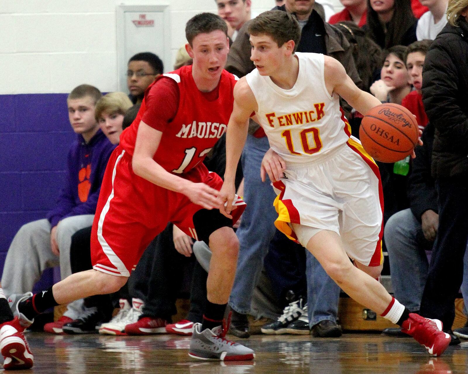 Madison guard Thomas Hall covers Fenwick guard Kevin Christie during a Division II sectional game at Bellbrook on Feb. 23, 2013. COX MEDIA FILE PHOTO