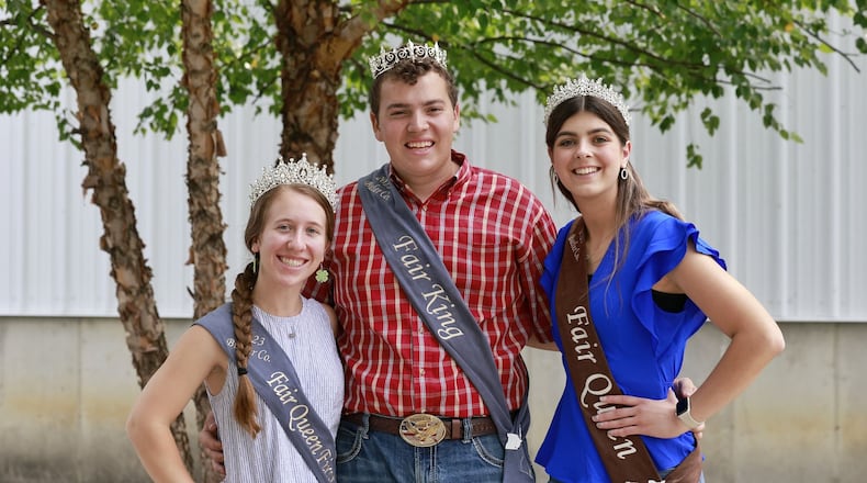 Butler County Fair Queen runner up LeAnn Niederman, left, King Ryland Beckner, middle, and Queen Alyssa Thompson will make appearances at many events during Butler County Fair in Hamilton. NICK GRAHAM/STAFF
