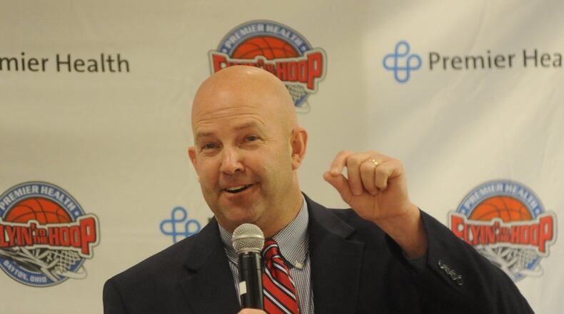 Springboro High School boys basketball coach Mike Holweger addresses the crowd during Tuesday’s news conference to announce the field for the 14th annual Premier Health Flyin to the Hoop at Good Samaritan North Health Center in Englewood in 2015. MARC PENDLETON / STAFF