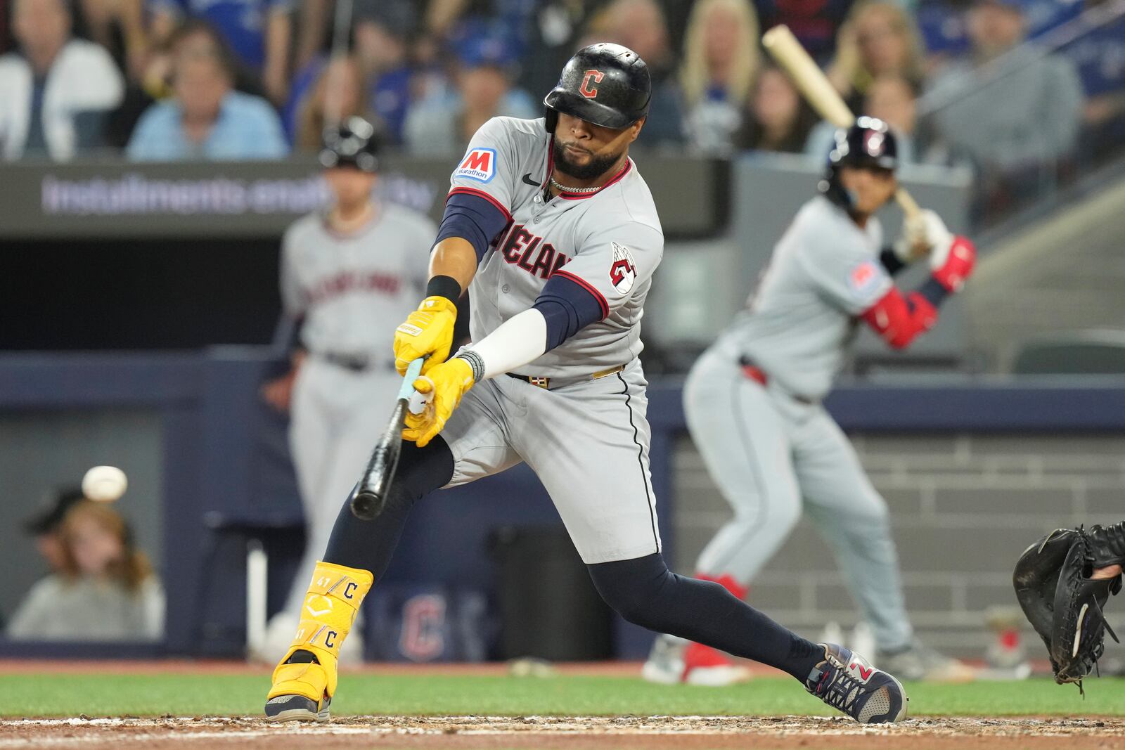 Cleveland Guardians' Carlos Santana hits an RBI single during the sixth inning of a baseball game against the Toronto Blue Jays in Toronto on Friday, May 2, 2025. (Chris Young/The Canadian Press via AP)