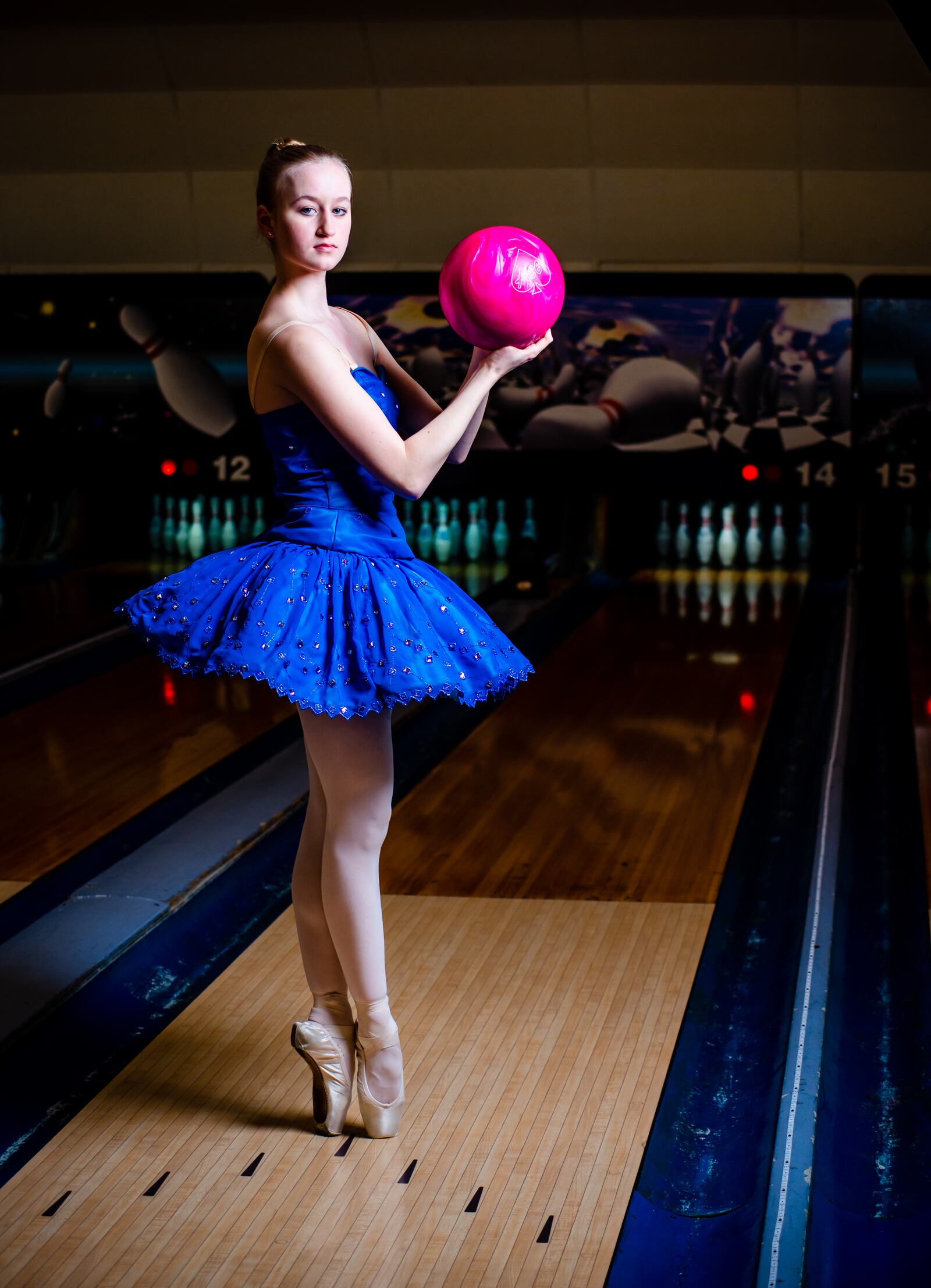 Clare Sherman, 15, with Miami Valley Ballet Theatre, poses for a photo at Pohlman Lanes and Family Entertainment Complex on Pyramid Hill Blvd. in Hamilton.
  Hamilton’s very own Miami Valley Ballet Theatre dancers are trading out their ballet slippers for bowling shoes, for a very special performance at Pohlman Lanes. Their brand new show is a Fab Four inspired production featuring the music of the Beatles that features an exciting mix of contemporary and modern dance. The Ballet, Beatles and Bowling show is part of Fitton Center's "Outside The Box" series showcasing live arts at around Hamilton. The performance is Sunday, April 11 from 3-5 p.m. NICK GRAHAM / STAFF 