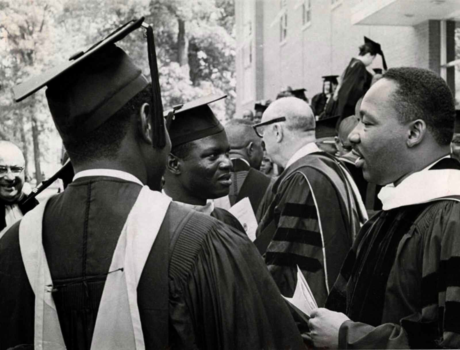 Dr. Martin Luther King Jr. (right) chats with students at Wilberforce University’s 107th commencement June 9, 1965. DAYTON DAILY NEWS / WRIGHT STATE UNIVERSITY SPECIAL COLLECTIONS