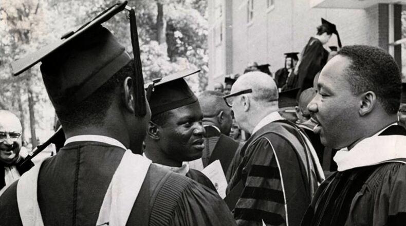 Dr. Martin Luther King Jr. (right) chats with students at Wilberforce University’s 107th commencement June 9, 1965. DAYTON DAILY NEWS / WRIGHT STATE UNIVERSITY SPECIAL COLLECTIONS
